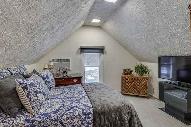 carpeted bedroom with a textured ceiling, a wall mounted AC, and lofted ceiling