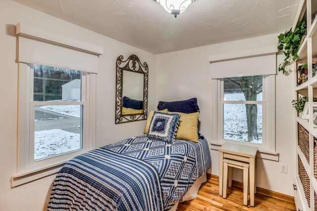 bedroom featuring hardwood / wood-style flooring