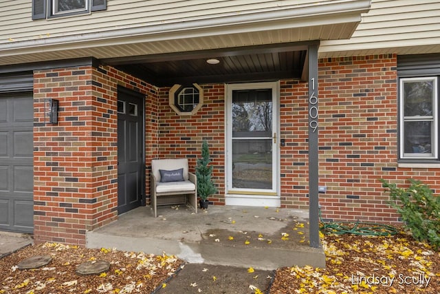 doorway to property featuring a garage