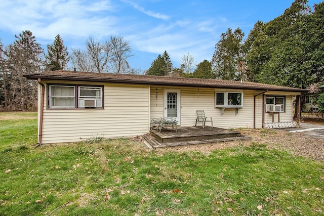 rear view of house with a yard