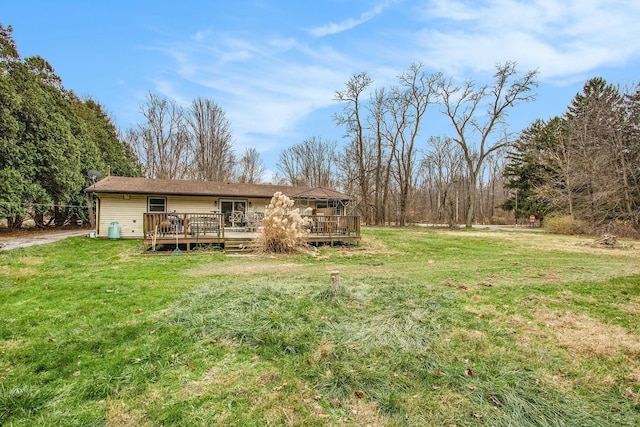 view of yard with a wooden deck