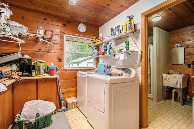 laundry room featuring wood walls, separate washer and dryer, and wooden ceiling