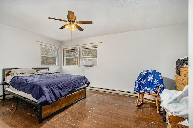 bedroom featuring baseboard heating, ceiling fan, and wood-type flooring