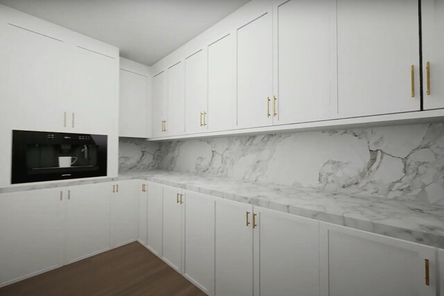 kitchen featuring decorative backsplash, light stone counters, white cabinets, and dark hardwood / wood-style floors