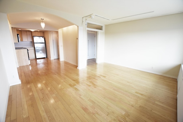 unfurnished living room with light hardwood / wood-style flooring