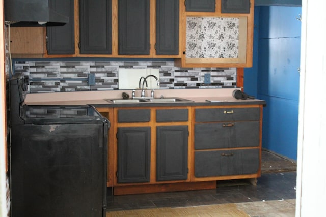 kitchen with sink, black electric range oven, and range hood