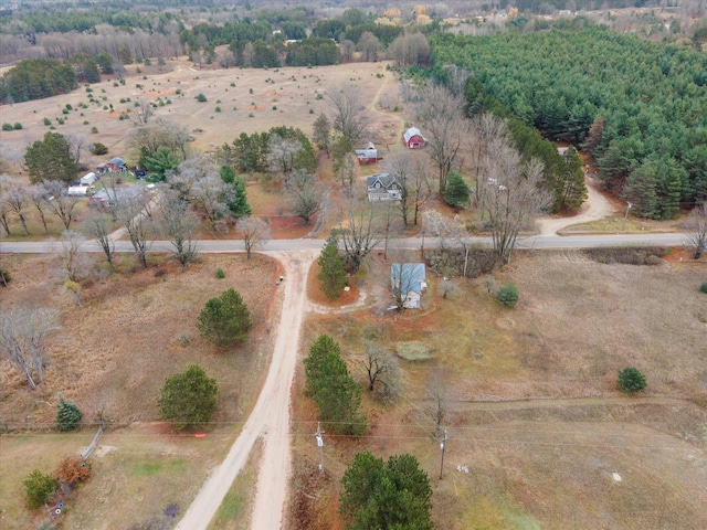 birds eye view of property featuring a rural view