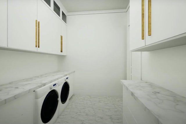 washroom featuring cabinets and separate washer and dryer