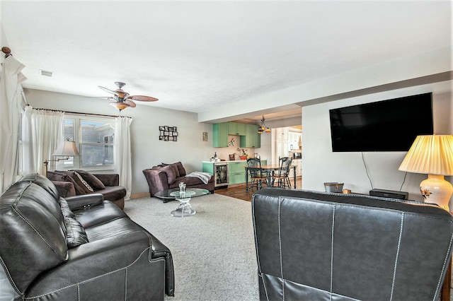 living room featuring wine cooler and ceiling fan