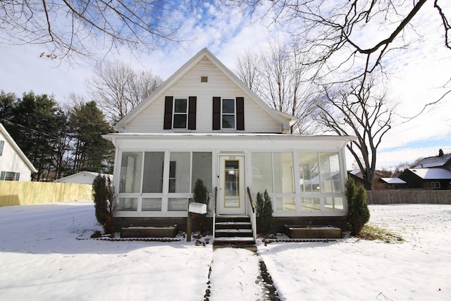 view of front of home featuring a sunroom