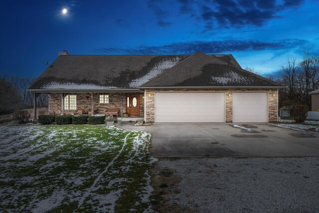 view of front facade with a lawn and a garage