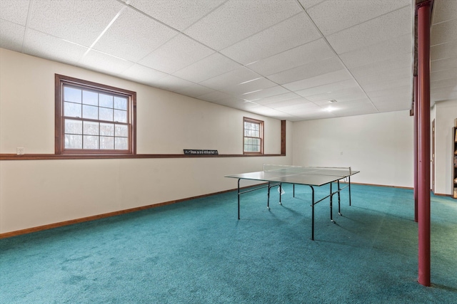 game room with a paneled ceiling and carpet floors