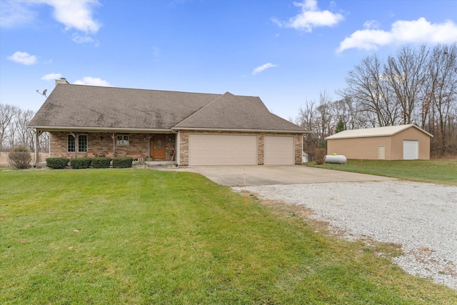 ranch-style house featuring a garage and a front yard