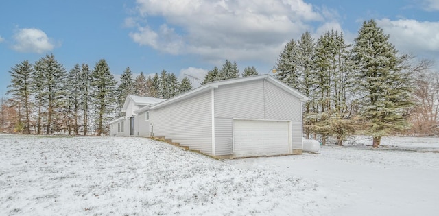 view of snow covered garage