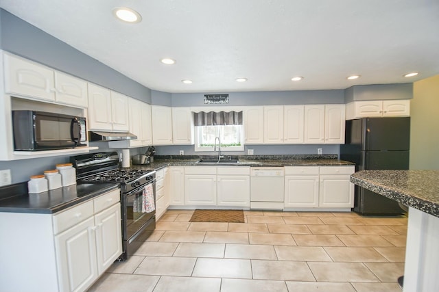 kitchen featuring sink, white cabinets, black appliances, and light tile patterned floors