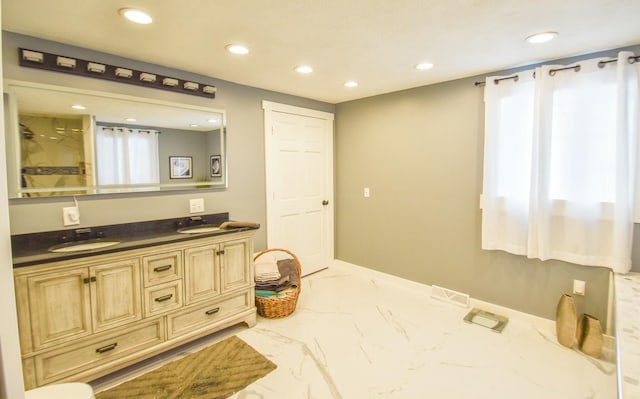 bathroom with vanity and walk in shower