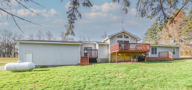 rear view of house featuring stairway, a yard, and a deck