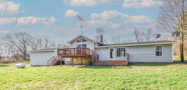 back of house with a lawn, a wooden deck, and stairs