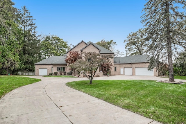 view of front facade featuring a front yard and a garage