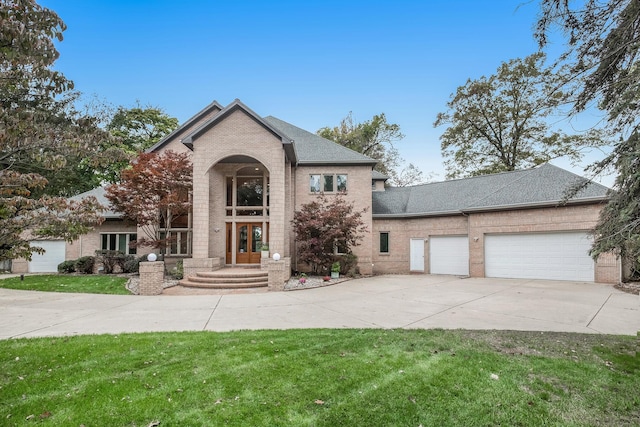 view of front of home featuring a garage and a front yard