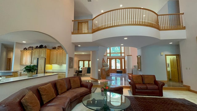 living room featuring a high ceiling