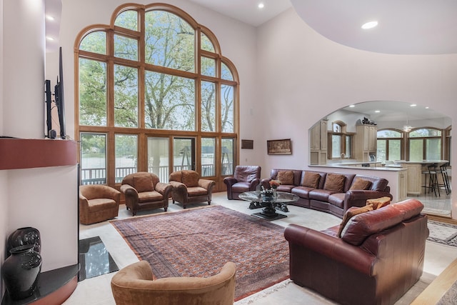 living room with a towering ceiling