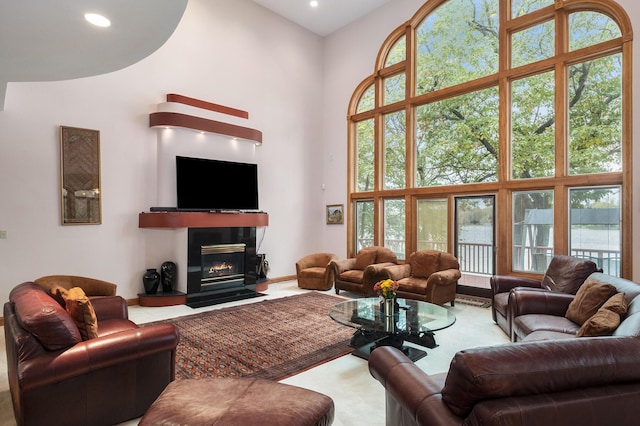 living room featuring a towering ceiling