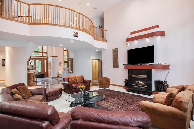 living room featuring a towering ceiling