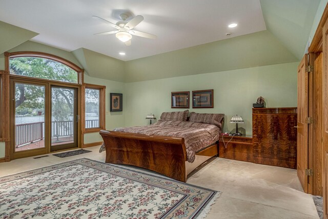 carpeted bedroom with access to exterior, ceiling fan, and lofted ceiling