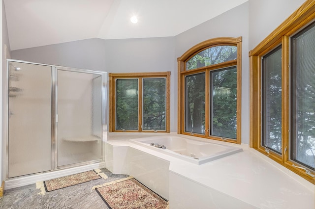 bathroom with separate shower and tub and lofted ceiling