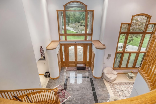 entryway with a high ceiling