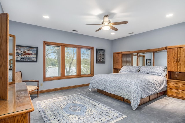 carpeted bedroom with ceiling fan