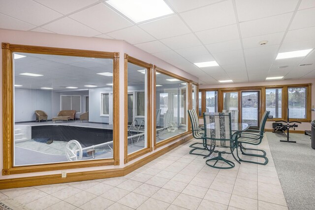 sunroom featuring a paneled ceiling