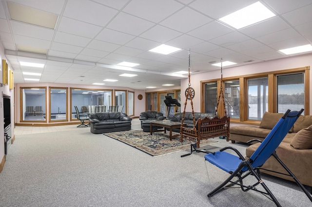 living room with light carpet and a paneled ceiling