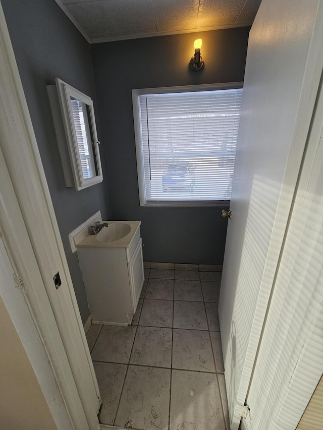 bathroom featuring tile patterned flooring and vanity