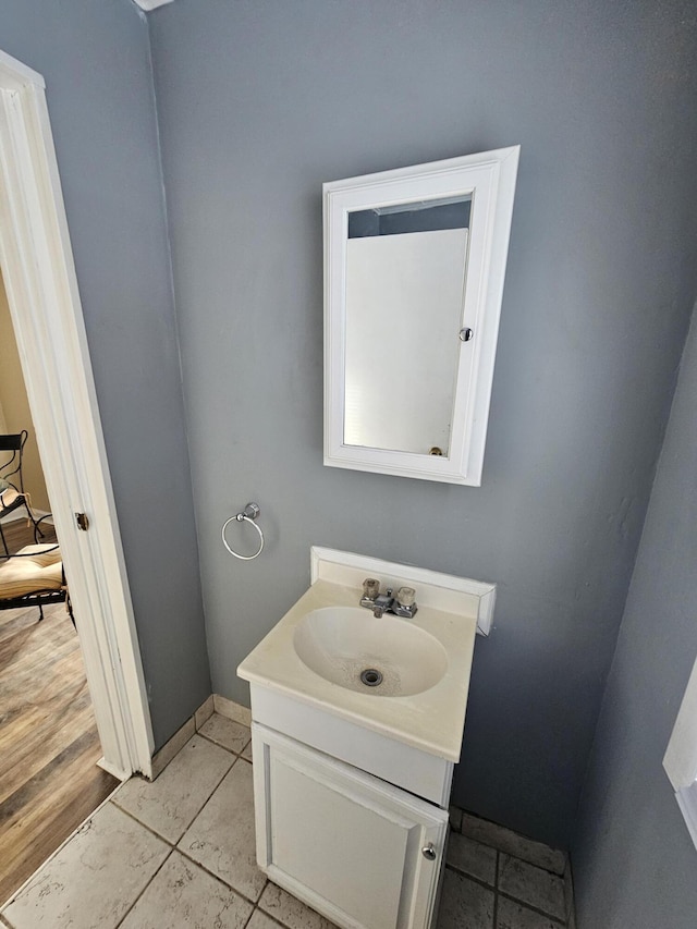 bathroom featuring hardwood / wood-style floors and vanity