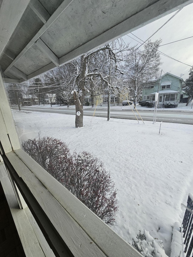 view of yard layered in snow