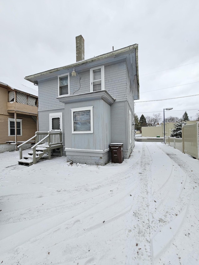 view of snow covered house