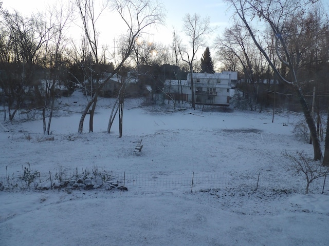 view of yard layered in snow