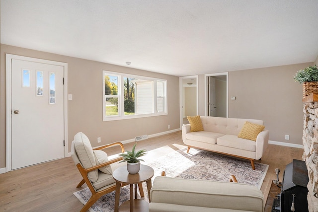 living room with light hardwood / wood-style flooring