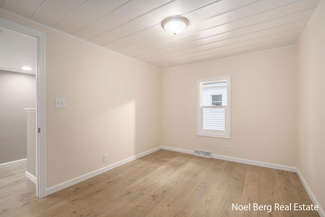 unfurnished room featuring wood ceiling and light hardwood / wood-style flooring