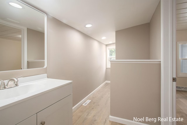 bathroom featuring vanity and hardwood / wood-style floors