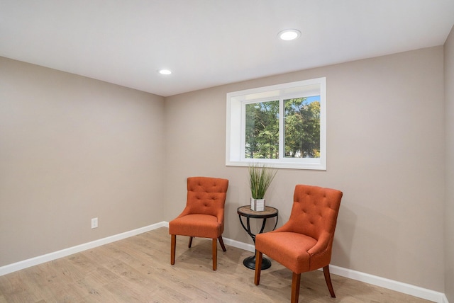 living area with light hardwood / wood-style floors