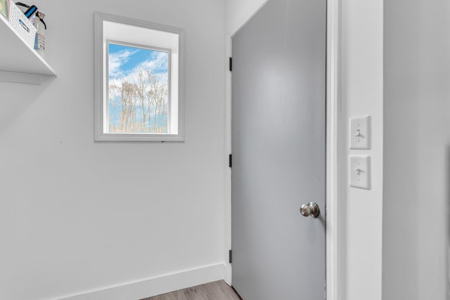 laundry room with light hardwood / wood-style flooring