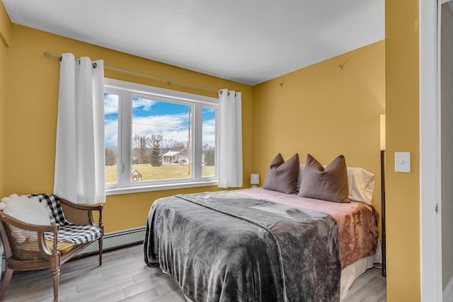 bedroom with light hardwood / wood-style flooring