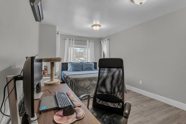 bedroom with wood-type flooring