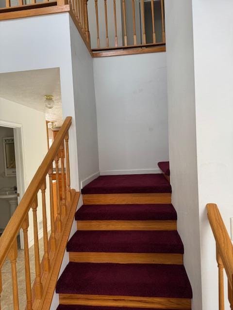 stairs featuring wood-type flooring