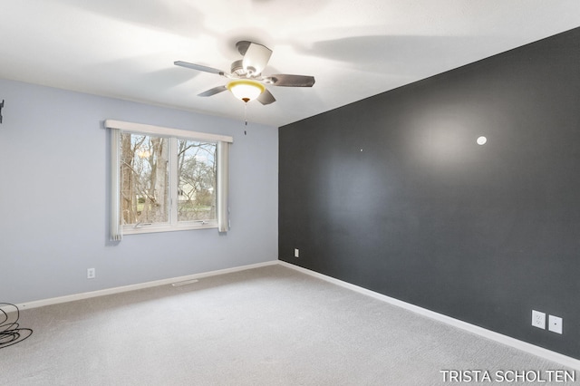 carpeted empty room with ceiling fan