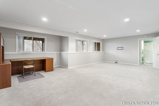 unfurnished office featuring light colored carpet