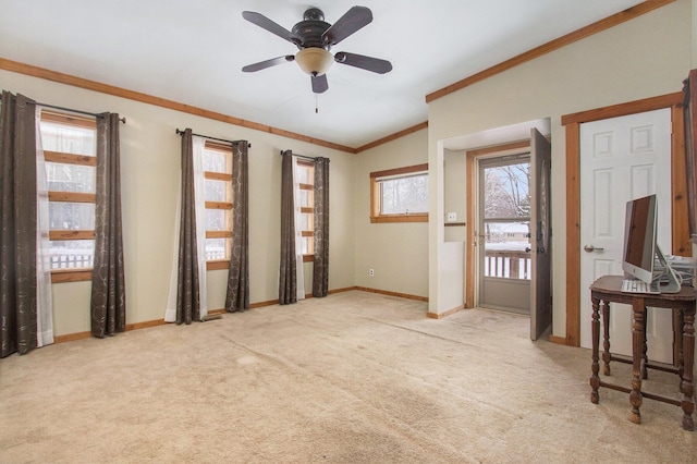 interior space with ceiling fan, light colored carpet, lofted ceiling, and crown molding